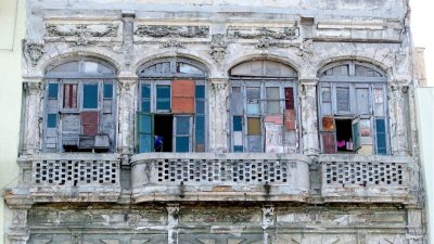Colorful window front facing Malecon, Havana, Cuba, urbex