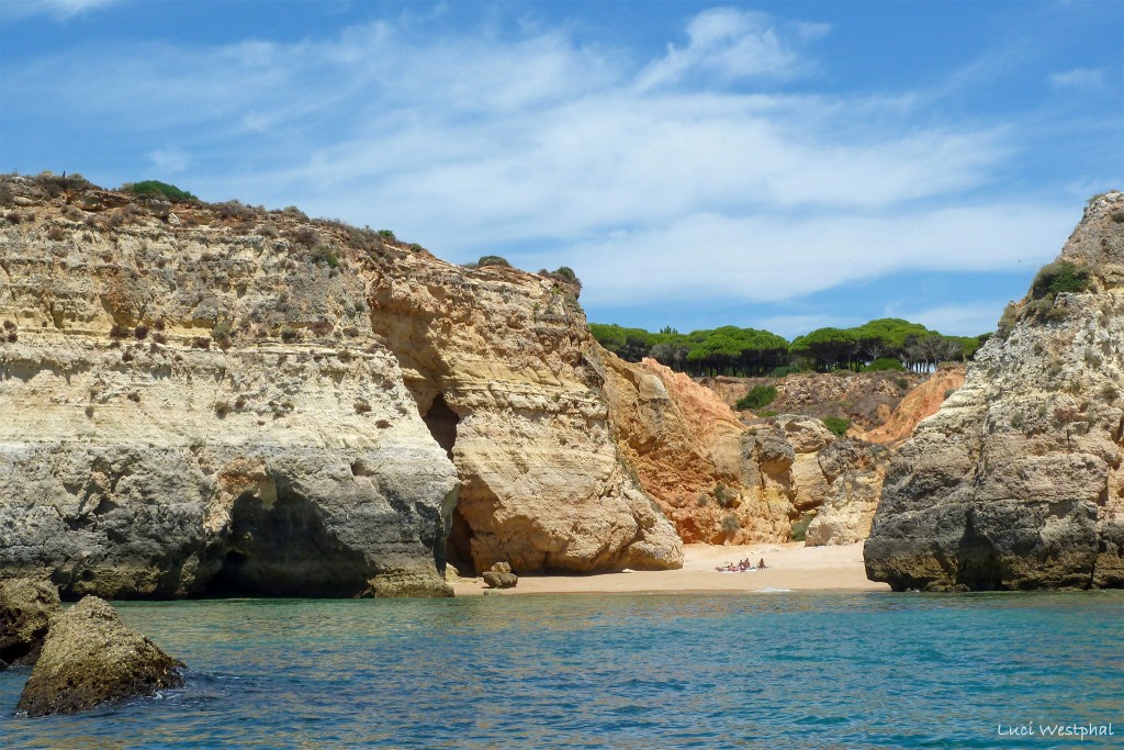 Hidden beach cove between rockwalls, Algarve, Portugal
