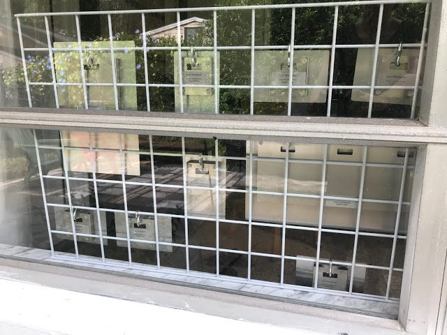 Backside of ready-to-hang metal prints by Bay Photo Lab and Happier Place