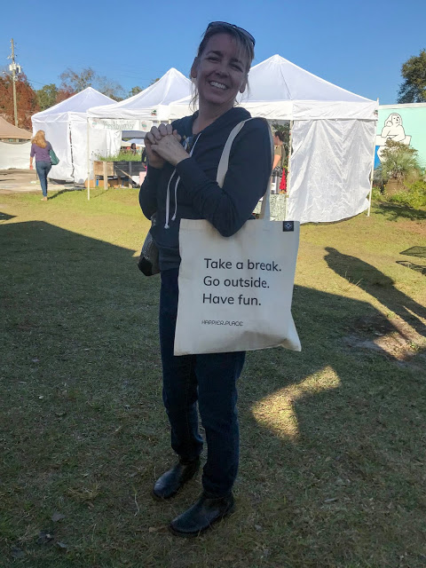 Smilig woman with Take a break. Go outside. Have fun. shoulder bag by Happier Place at indie craft market