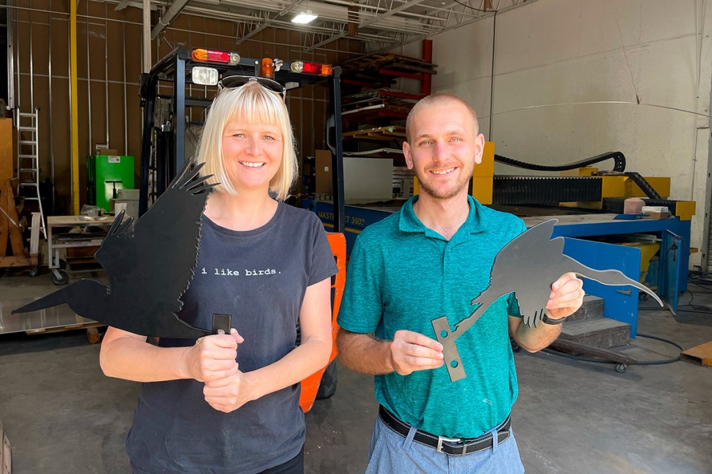 Luci picking up her metal birds from Mike at Hydroknife in Tampa