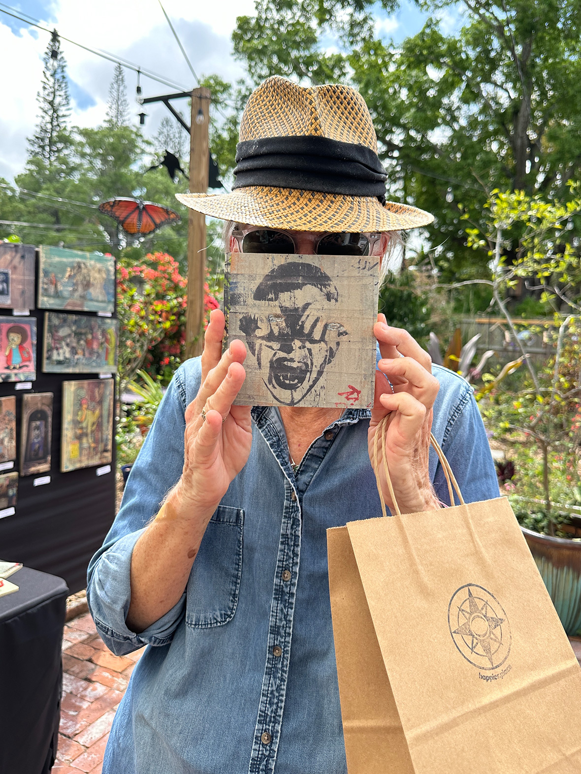 woodtransfer of photo featuring street art by Alias held by Victoria Jorgensen