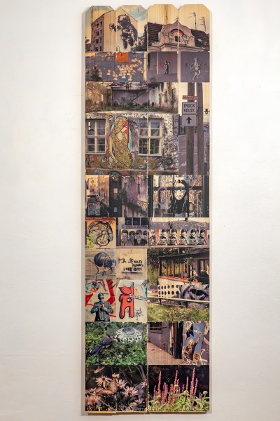 collage of urban photography hand-transferred to wood fence panel, part of installation Public Walls and In-Between Spaces, Panel 7: Astronaut
