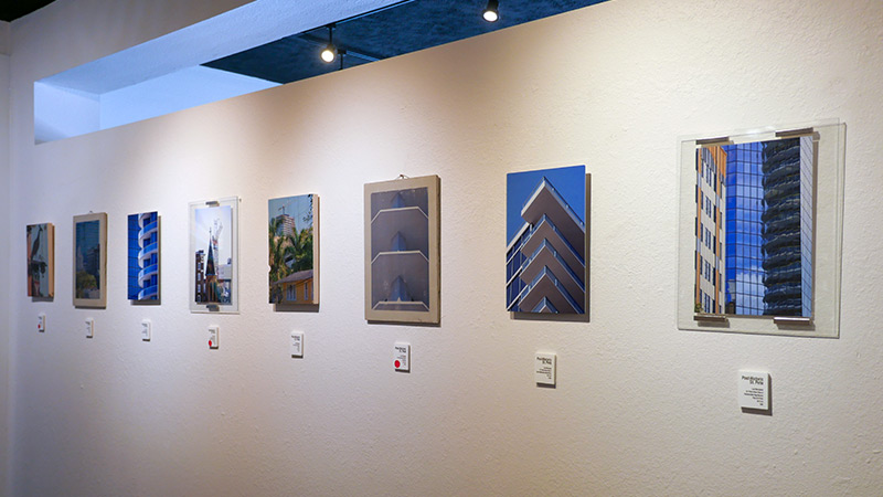 Individual photos displayed with construction-related material: wood, glass, metal, concrete