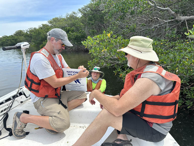 Installing new National Wildlife Refuges signs