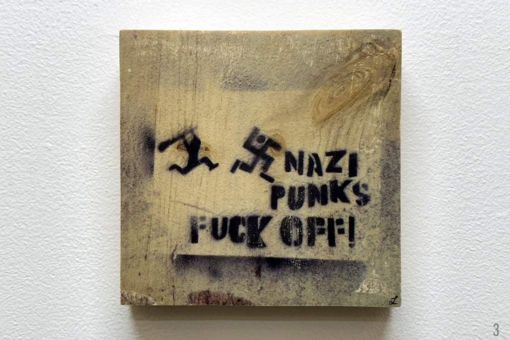 nazi punks fuck off, swastika being chased, graffiti, stencil, wood transfer