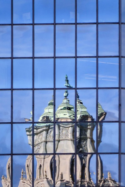 Snell Arcade tower reflected in glass front of office building in downtown St. Petersburg, Florida.