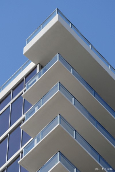 high rise balconies, blue sky, edge